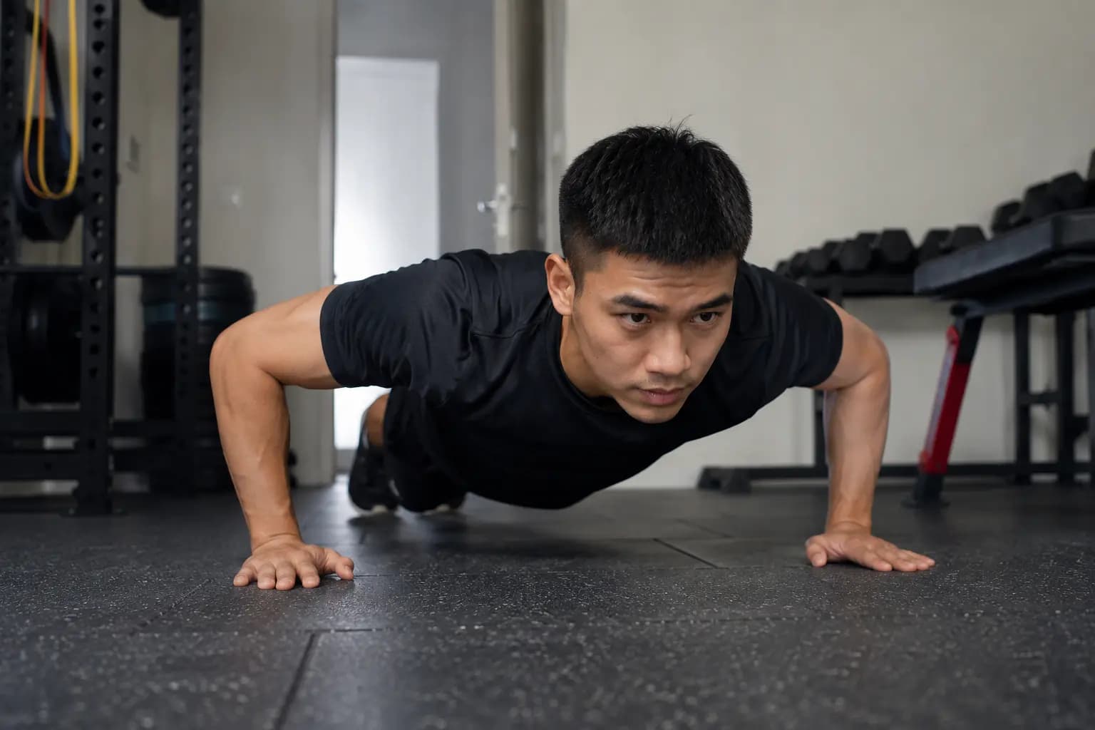 Man doing push-up training for IPPT preparation in gym